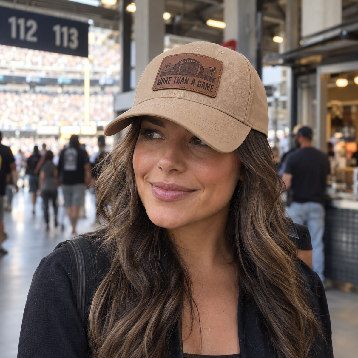 Woman wearing More Than a Game leather patch cap