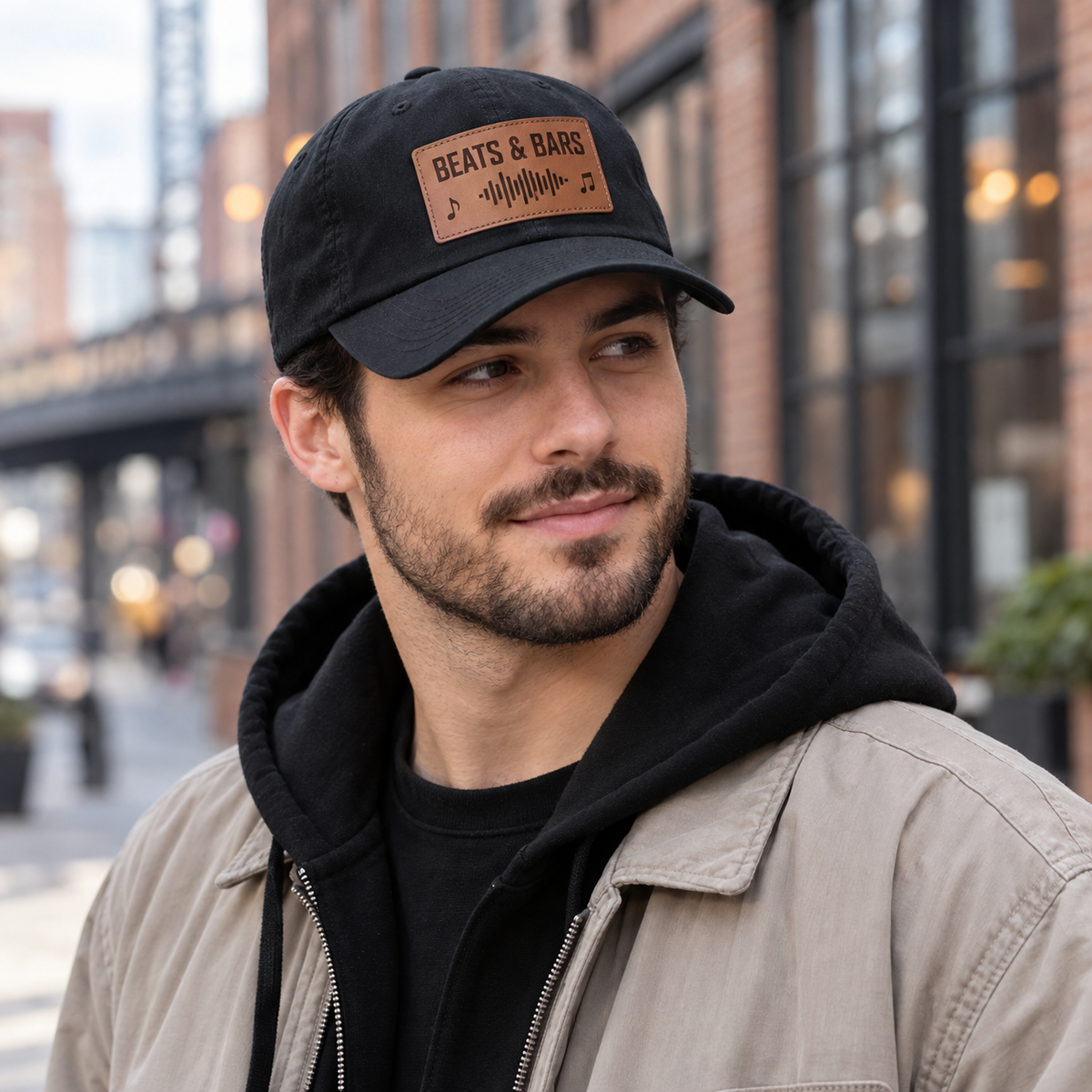 Man wearing Beats and Bars engraved leather patch cap