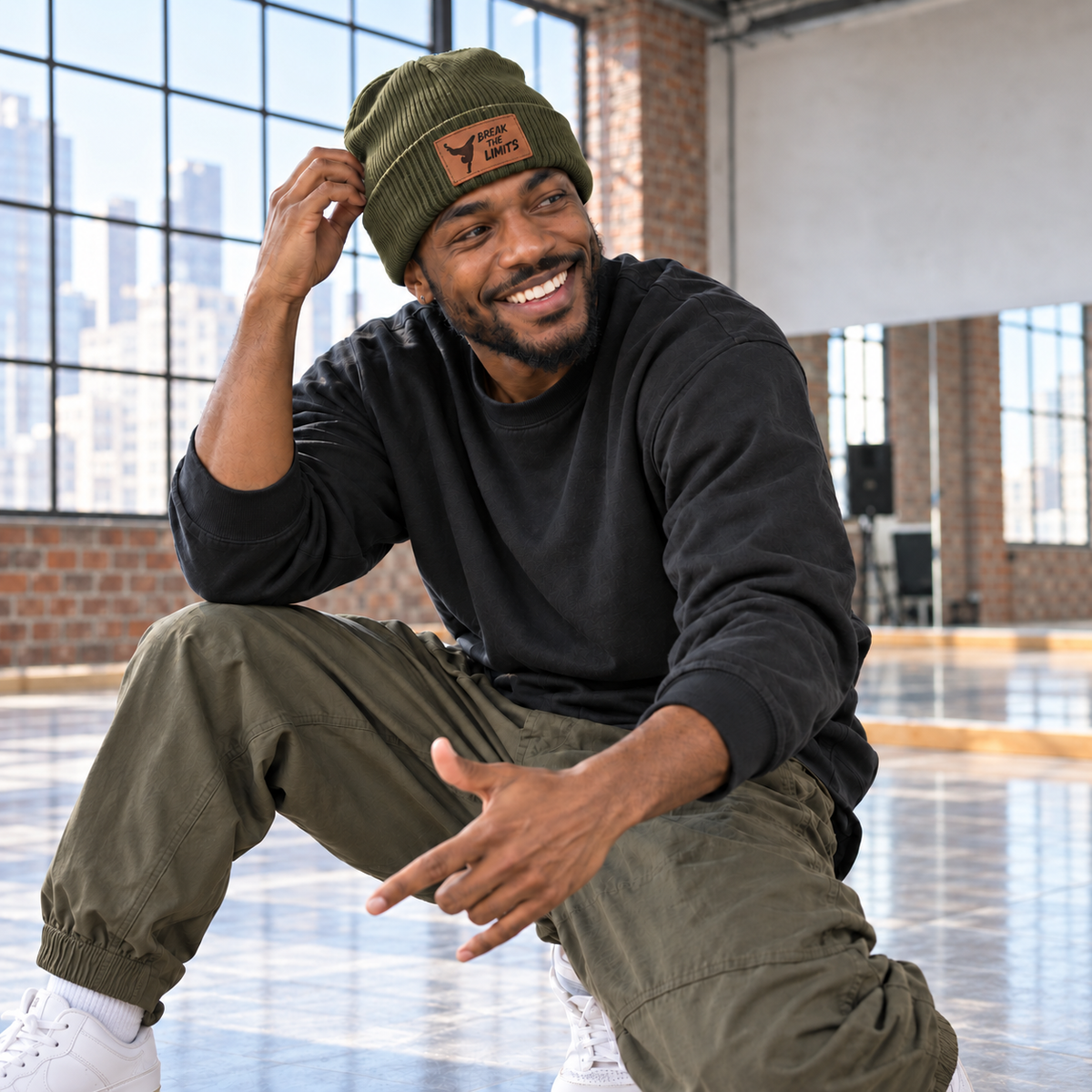 Man wearing olive Break the Limits engraved leather patch beanie