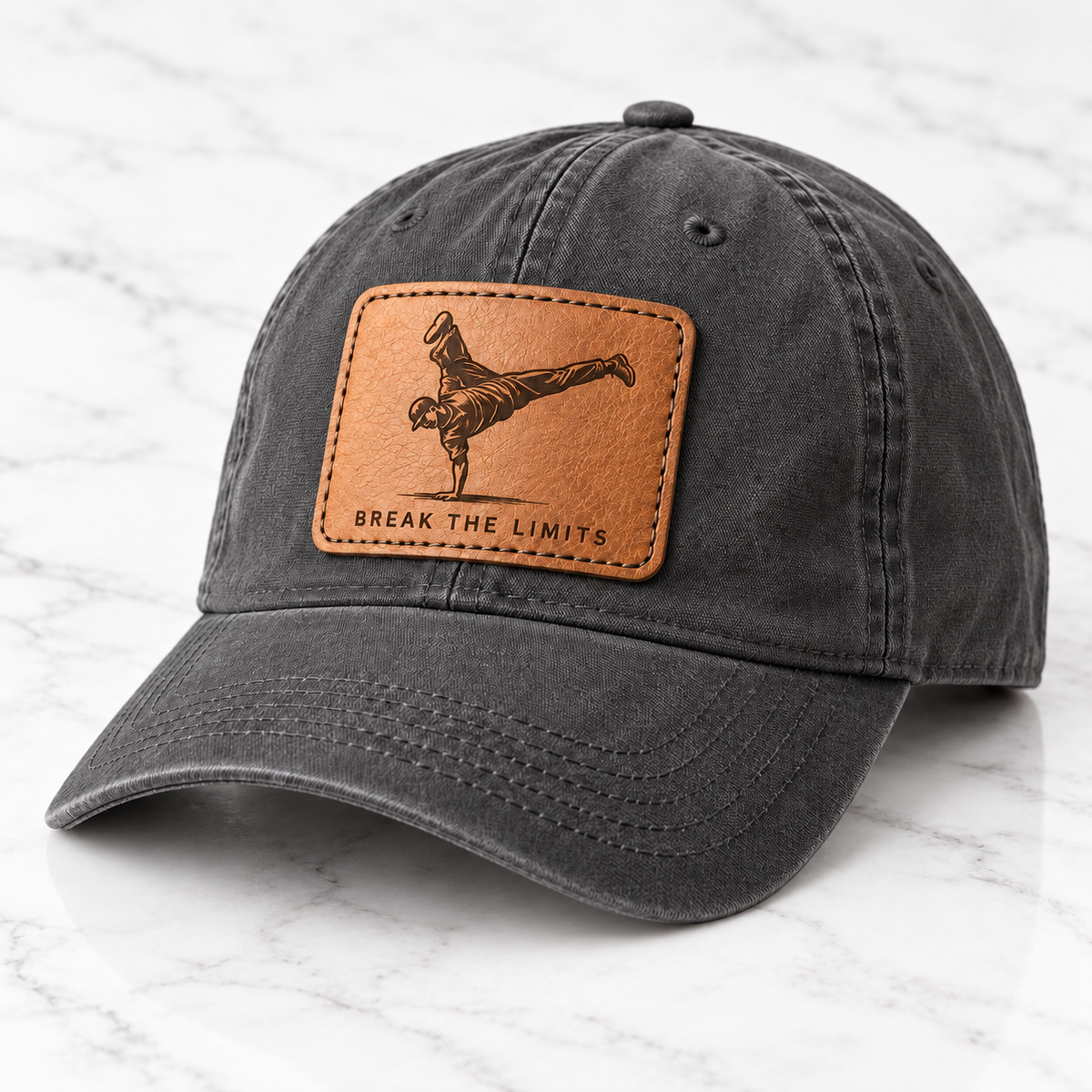 Break the Limits leather patch baseball cap on white marble tile
