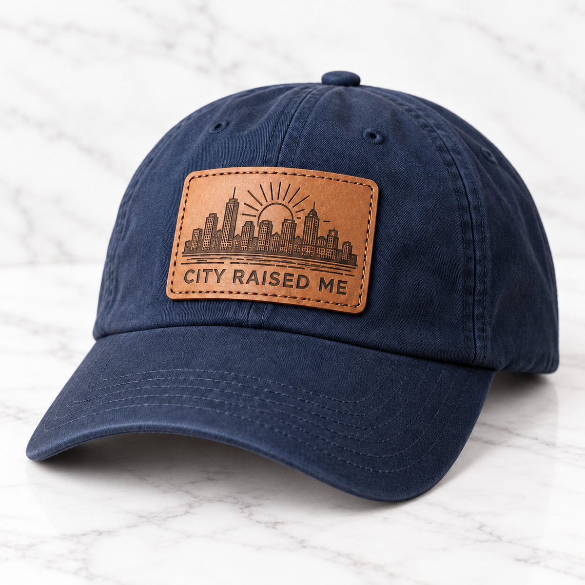 City Raised Me leather patch baseball cap on white marble tile