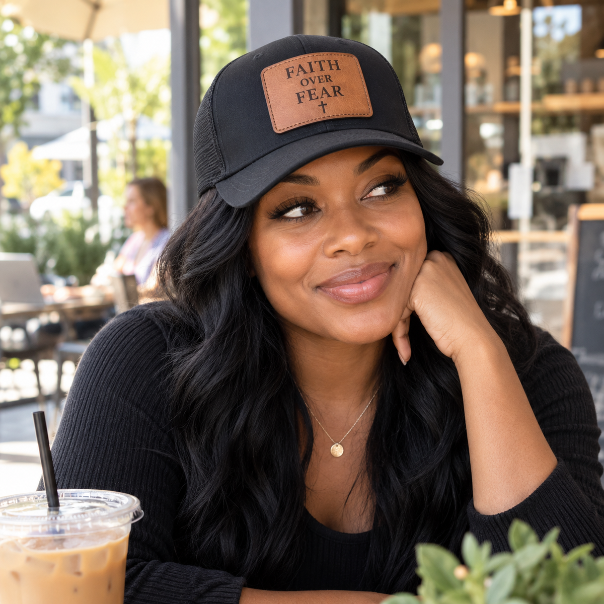 Woman wearing Faith Over Fear leather patch cap