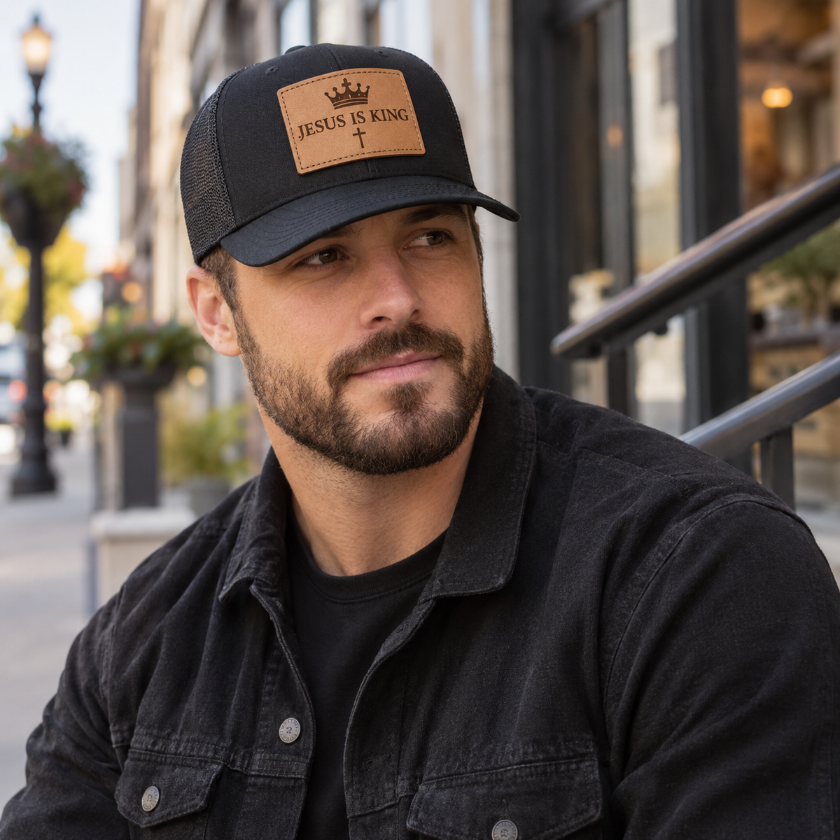 Man wearing Jesus Is King leather patch cap