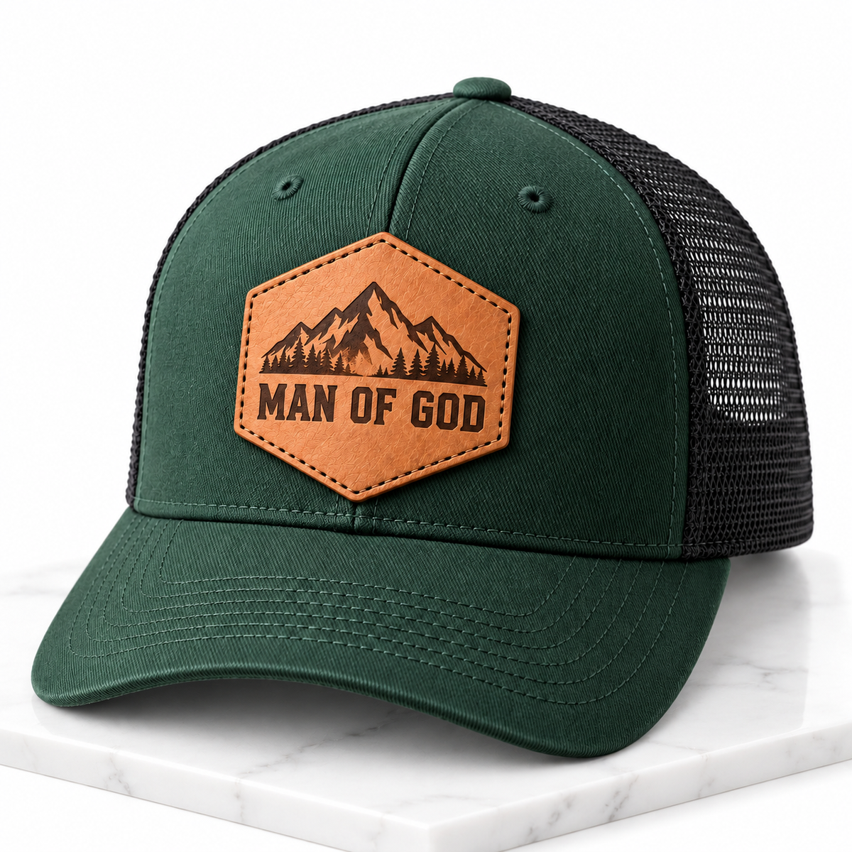 Man of God leather patch trucker hat on white tile