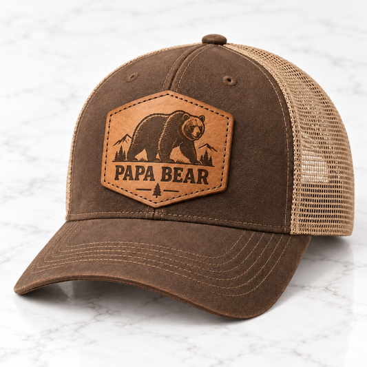 Papa Bear leather patch trucker hat on white tile
